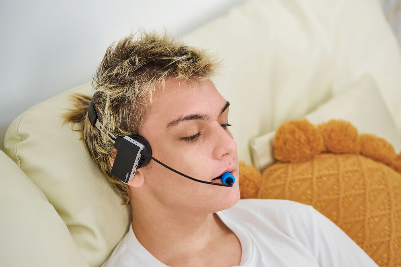 GlassOuse PRO Model 1 worn while lying down — works in any position
