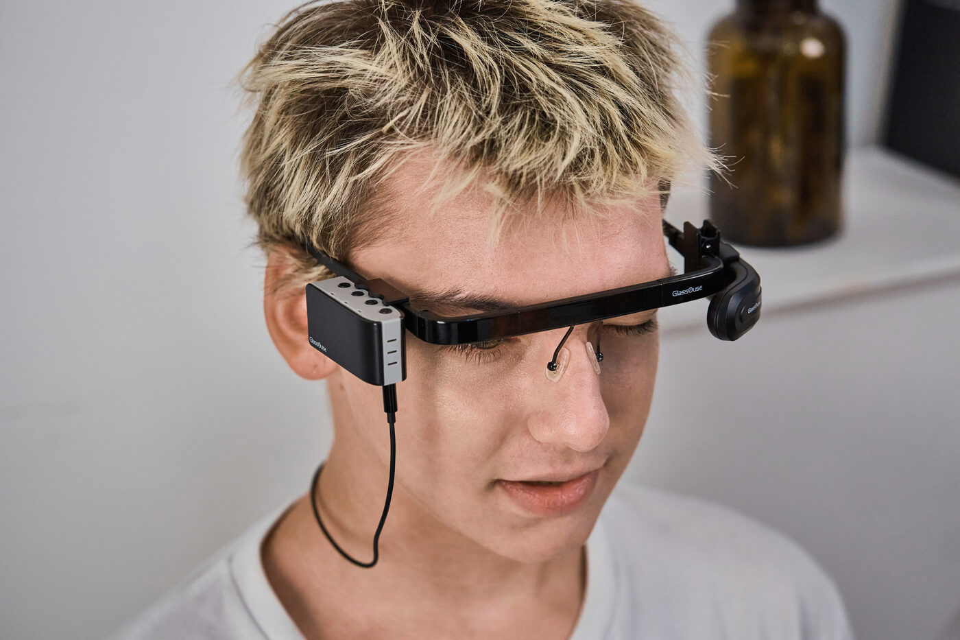 Person wearing GlassOuse PRO Model 1 headband indoors